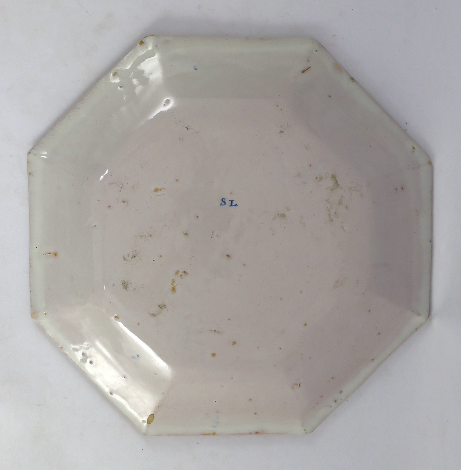 A large Strasbourg faience octagonal dish, c.1720-40, 35.5cm wide